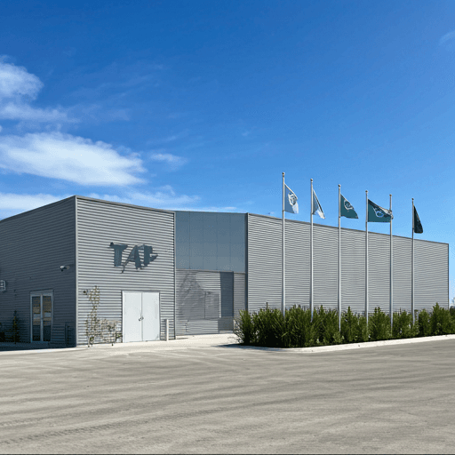 TAP Facility exterior with flags